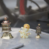 The prayer wheels and statue on our car.